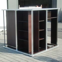The image shows a modular shelving unit with several compartments. It features a metal frame and dark wooden shelves. The unit appears to be designed for storage and organization, likely suitable for a workshop, garage, or industrial setting.