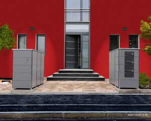 The image shows a modern entrance to a building with a red facade. There are two gray storage units or cabinets positioned on either side of a walkway leading up to the entrance. The entrance door is sleek and contemporary, with steps leading up to it. There are windows on either side of the door, and two small trees add greenery to the scene.