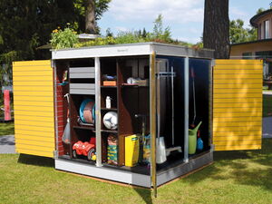 . The image shows a garden storage unit with open doors, revealing various gardening and outdoor items inside. These include shelves holding a hose, a rake, a soccer ball, a watering can, other gardening tools, and supplies. The storage unit has yellow doors and is situated outdoors on grass, with plants on its roof.