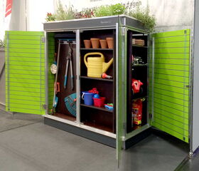 . Here's an array listing the items in the image:

```plaintext
[
  "Green outdoor storage cabinet",
  "Gardening tools (pruning shears, rake)",
  "Yellow watering can",
  "Small flower pots",
  "Red and blue plastic buckets",
  "Gardening gloves",
  "Plant fertilizer bag",
  "Plants on top of the cabinet"
]
```