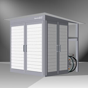 The image shows a modern outdoor storage shed. It's made of metal with sliding doors and has a small extension on the side for additional storage. A bicycle is partially visible, indicating the shed's use for storing outdoor equipment.