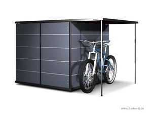 . Ein grauer Gartenschrank mit einem Fahrrad davor.