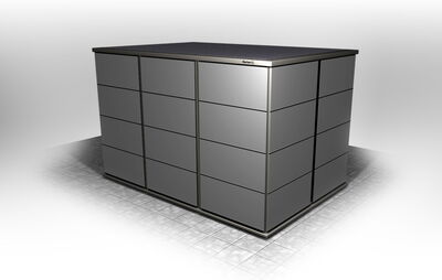 The image shows a metallic storage cabinet, likely used for industrial or office purposes. It has a sleek, modern design with several drawers, arranged in a grid pattern. The cabinet is placed on a tiled floor.