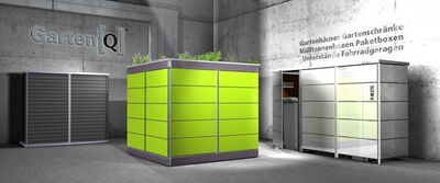 The image shows a modern, industrial-style outdoor setup. There are several cuboidal structures with sleek metallic and green panels. One structure has plants on top, suggesting it could be a planter or a garden box. The surroundings have concrete surfaces and walls, with signage in German indicating various garden-related products like garden houses and cabinets. The design overall has a clean and contemporary look.