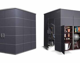 . The image shows two modern storage sheds. 

- The left shed is closed, displaying a sleek, dark exterior with a clean design.
- The right shed is open, revealing various stored items: a bicycle, shelves with pots, a garden hose, a barbecue grill, a toy car, and a lawnmower. 

Both sheds appear to be designed for outdoor use, providing organized storage for garden equipment and other items.