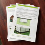 The image shows a stack of printed documents on a wooden surface. The top document has text and images, one of which appears to be a diagram or illustration related to construction or architecture. The pages have green accents or headings, and there are multiple sheets visible.