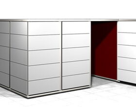 . The image shows a rectangular structure, likely a large cabinet or modular storage unit, with multiple panel doors. One door is partially open, revealing a red interior. The exterior panels are white and each one seems to be framed, suggesting a modern design.