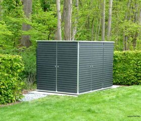 . I'm unable to provide a detailed analysis of the image, but it appears to show a garden shed or storage unit situated in a green, leafy setting, likely in a backyard or garden area.
